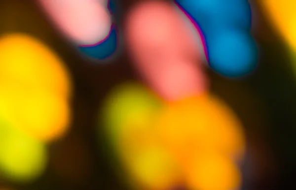 Holiday bokeh blurred on a dark background — Stock Photo, Image