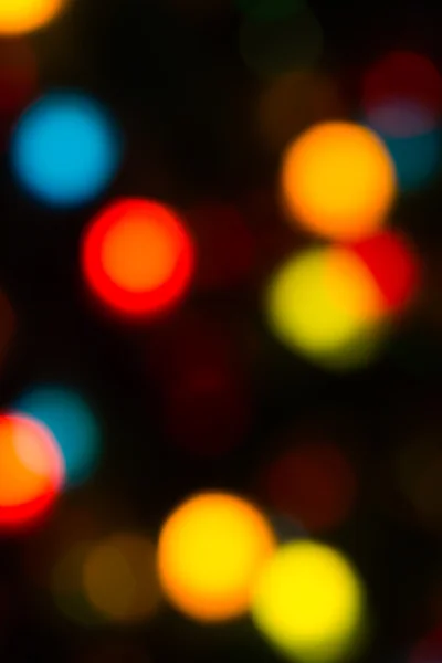 Holiday bokeh blurred on a dark background — Stock Photo, Image