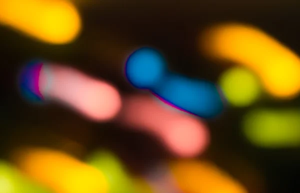 Holiday bokeh blurred on a dark background — Stock Photo, Image