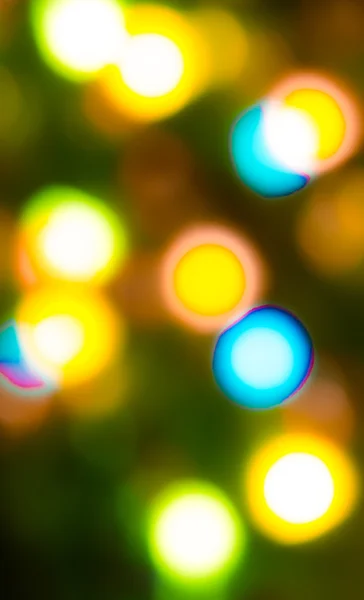 Holiday bokeh blurred on a dark background — Stock Photo, Image