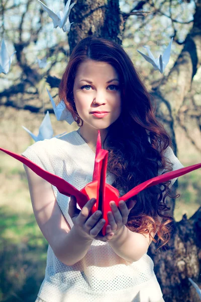 Girl with origami crane — Stock Photo, Image