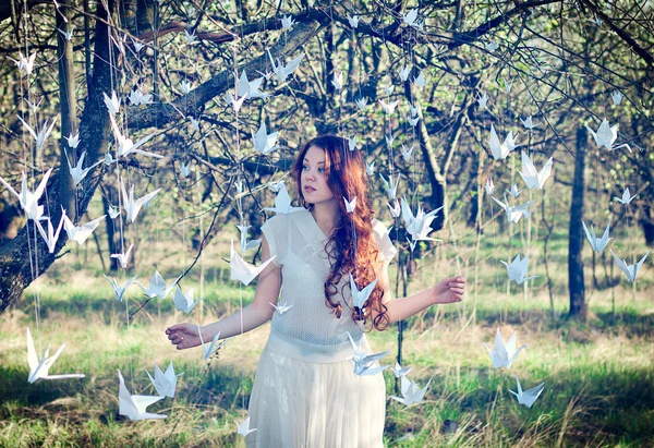 Girl with origami cranes — Stock Photo, Image