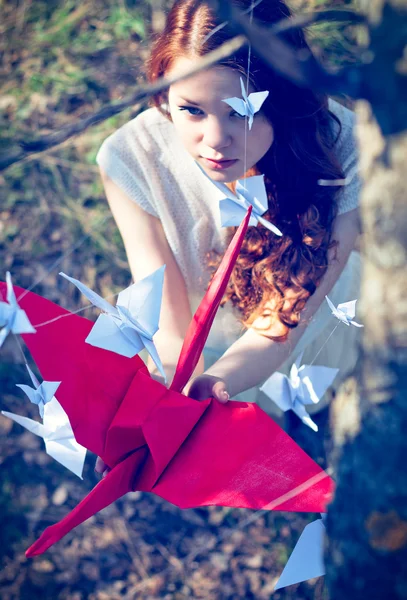 Girl with origami crane — Stock Photo, Image