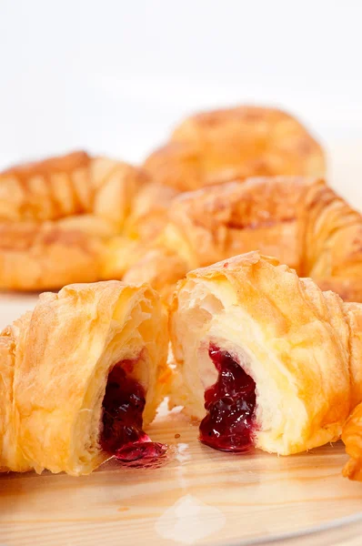 Croissant French brioche filled with berries jam — Stock Photo, Image
