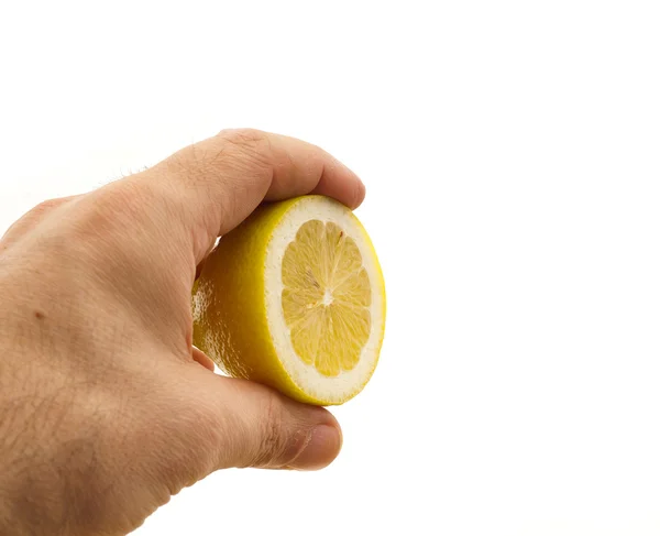 Fresh half lemon on hand — Stock Photo, Image