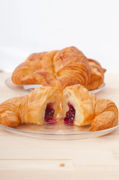 Croissant French brioche filled with berries jam — Stock Photo, Image