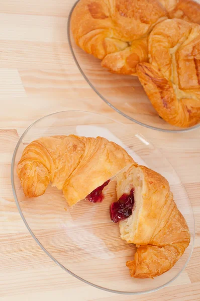 Croissant French brioche filled with berries jam — Stock Photo, Image