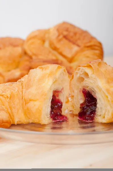 Croissant French brioche filled with berries jam — Stock Photo, Image