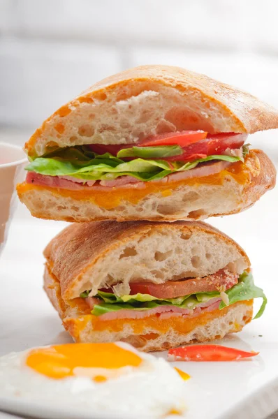 Ciabatta panini sandwich eggs tomato lettuce — Stock Photo, Image