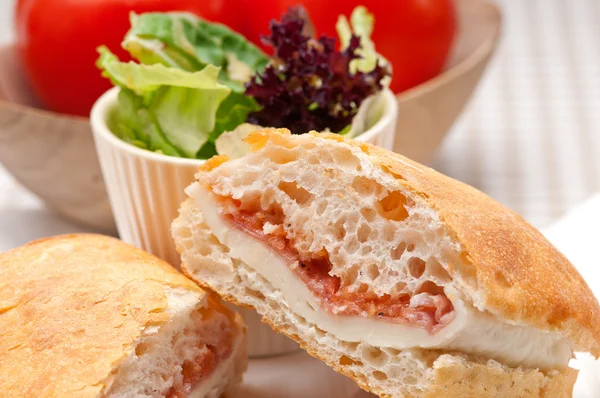 Ciabatta panini sandwich with parma ham and tomato — Stock Photo, Image