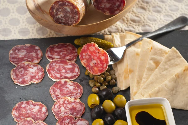 Cold cut platter with pita bread and pickles — Stock Photo, Image