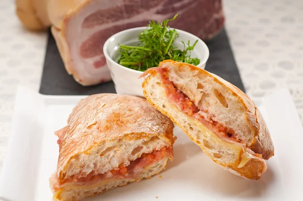 Ciabatta panini sandwich with parma ham and tomato — Stock Photo, Image