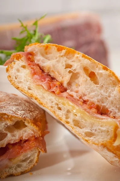 Ciabatta panini sandwich with parma ham and tomato — Stock Photo, Image