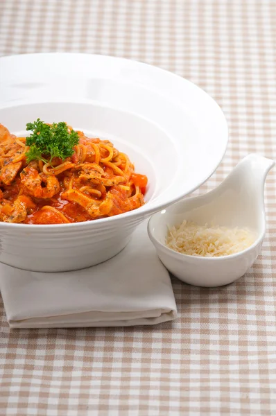 Italian spaghetti pasta with tomato and chicken Stock Photo