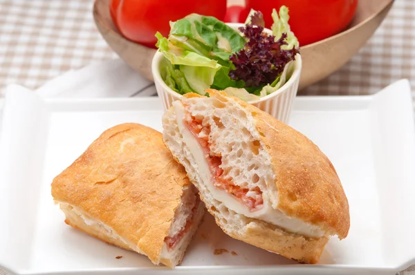 Ciabatta panini sandwich with parma ham and tomato — Stock Photo, Image