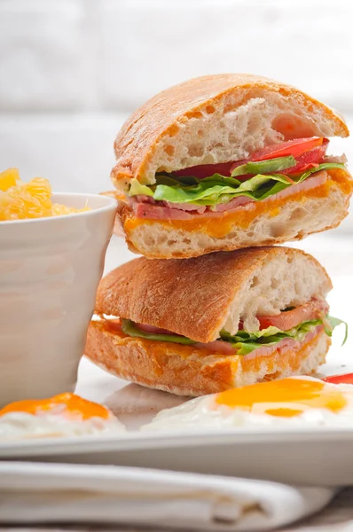 Ciabatta panini sandwich eggs tomato lettuce — Stock Photo, Image