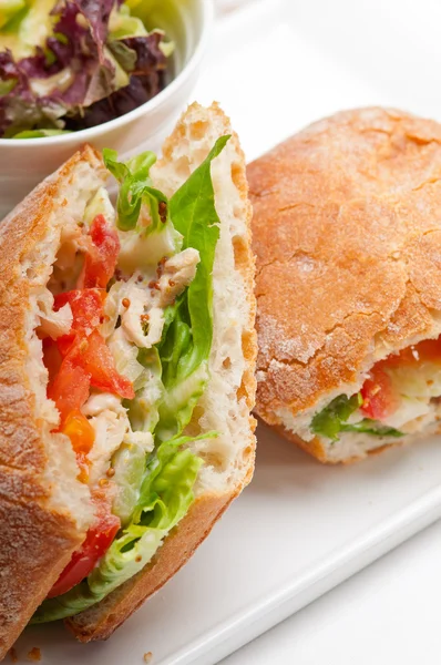 Ciabatta panini sandwich with chicken and tomato — Stock Photo, Image
