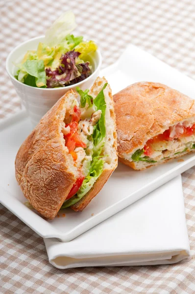 Ciabatta panini sandwich with chicken and tomato — Stock Photo, Image