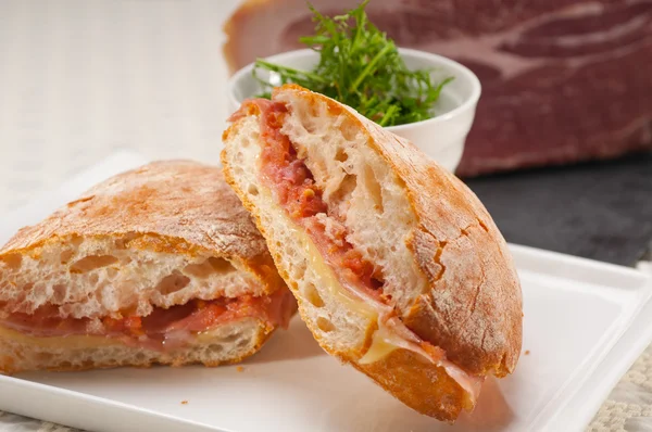 Ciabatta panini sandwich with parma ham and tomato — Stock Photo, Image