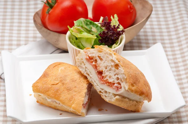 Ciabatta panini sandwich with parma ham and tomato — Stock Photo, Image