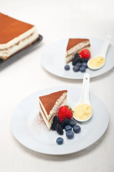 Tiramisu dessert with berries and cream — Stock Photo, Image