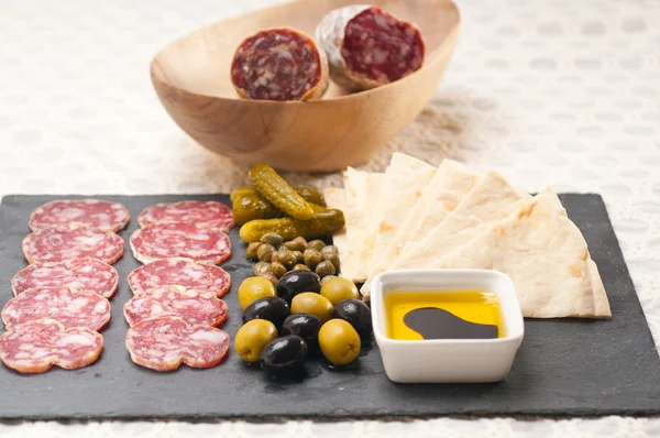 Cold cut platter with pita bread and pickles — Stock Photo, Image