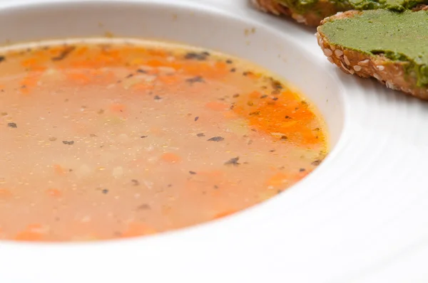 Italian minestrone soup with pesto crostini on side — Stock Photo, Image