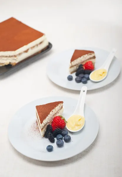 Tiramisu dessert with berries and cream — Stock Photo, Image