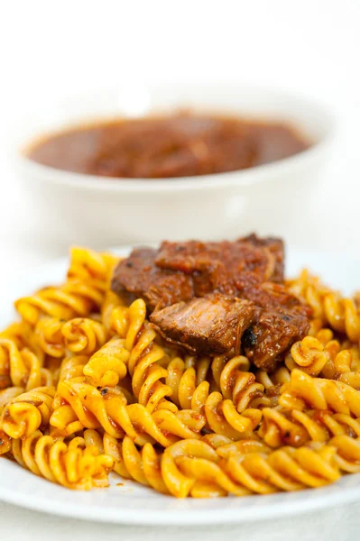 Fusilli pasta with neapolitan style ragu meat sauce — Stock Photo, Image