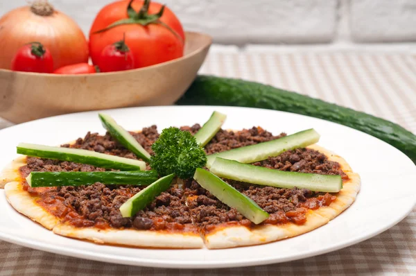 Turkish beef pizza with cucumber on top — Stock Photo, Image