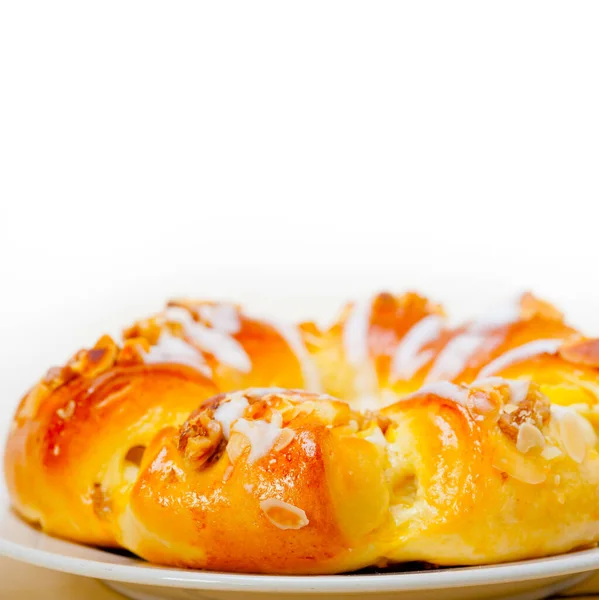 fresh home baked sweet bread donut cake with almonds and icing sugar on top