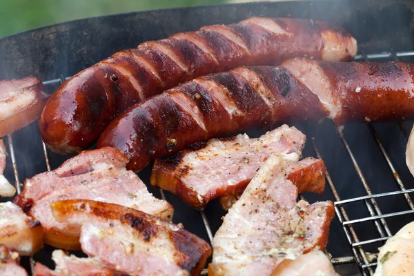 Barbecue with delicious grilled meat on grill — Stock Photo, Image