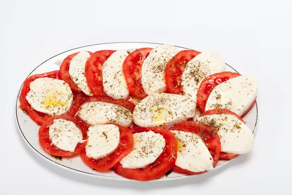 Tomatos and mozarella cheese — Stock Photo, Image