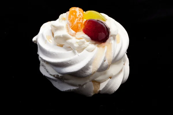 Sweet cake with fruits isolated on black — Stock Photo, Image