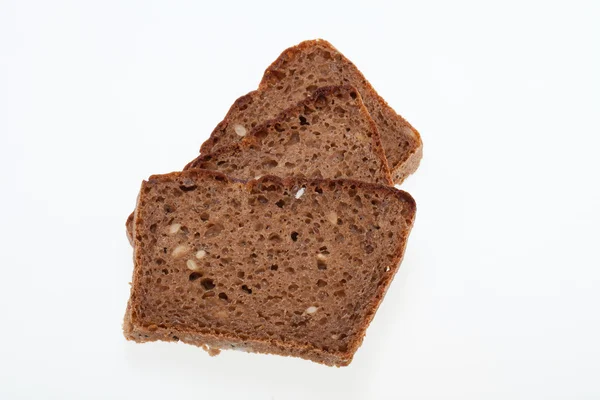 Slices of dark bread isolated over white — Stock Photo, Image