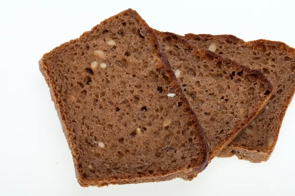 Slices of dark bread isolated over white — Stock Photo, Image