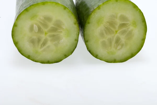 Freshly sliced cucumber isolated on white background — Stock Photo, Image