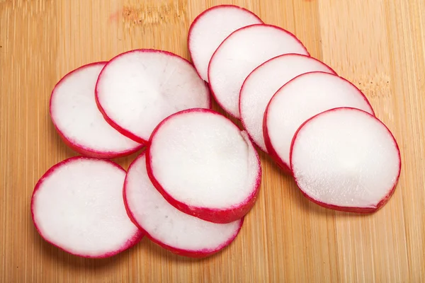 Garden radish on wooden board — Stock Photo, Image