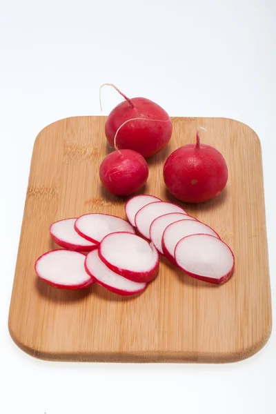 Garden radish on wooden board — Stock Photo, Image