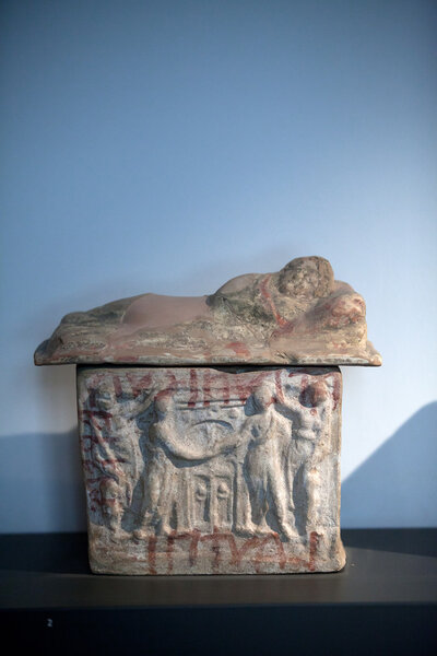 Painted terracotta cienrary urns.