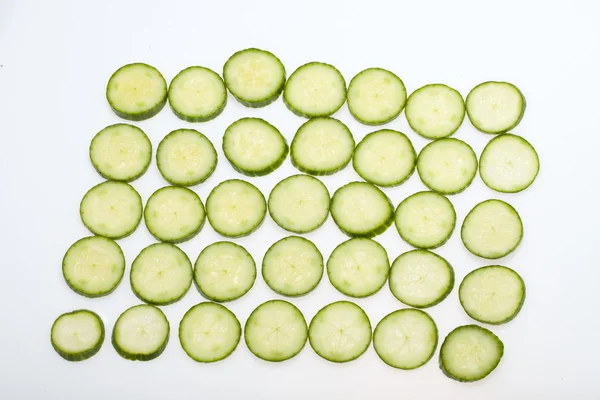 Freshly sliced cucumber isolated on white background — Stock Photo, Image