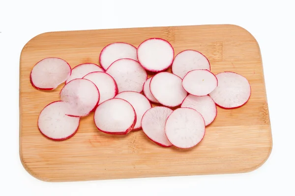 Garden radish on wooden board — Stock Photo, Image