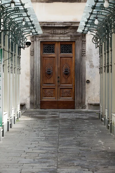 Wooden residential doorway in Tuscany. Italy Royalty Free Stock Images
