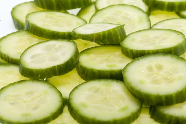 Freshly sliced cucumber isolated on white background — Stock Photo, Image