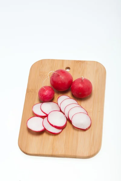 Garden radish on wooden board — Stock Photo, Image