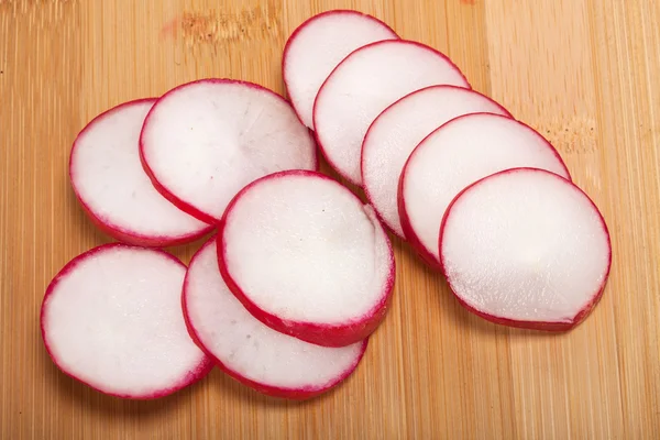 Garden radish on wooden board — Stock Photo, Image