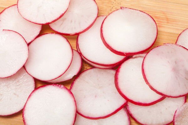 Garden radish on wooden board