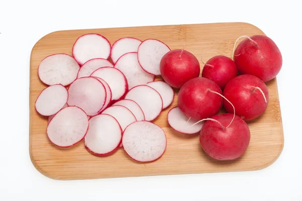 Garden radish on wooden board — Stock Photo, Image