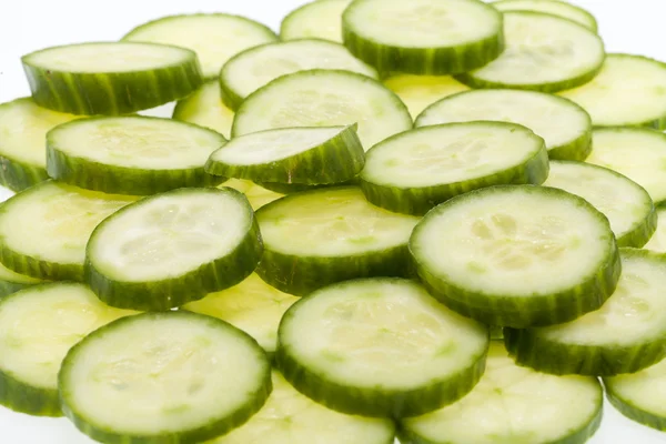 Freshly sliced cucumber isolated on white background — Stock Photo, Image