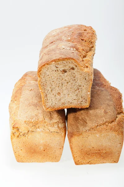 Loaves of bread traditionally roasted. Background. Close up. — Stock Photo, Image